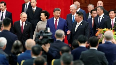 Chinese President Xi Jinping, Russian President Vladimir Putin and North Korean leader Kim Jong Un arrive for a reception (REUTERS)