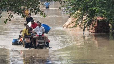 After flood-like situation near Delhi's Signature Bridge due to release of water from Hathnikund barrage, people were forced to move to safer locations. (ANI)