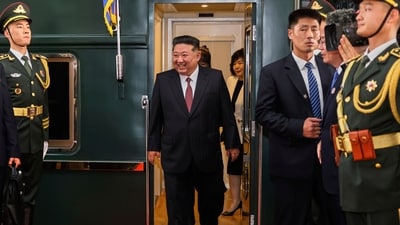 North Korean leader Kim Jong Un seen embarking from his iconic green-train as he arrived in China for the victory parade on Tuesday. (AP) North Korean leader Kim Jong Un seen embarking from his iconic green-train as he arrived in China for the victory parade on Tuesday. (AP)
