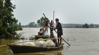 Locals carry their belongings on a boat as they move to a safer place from a flood-affected area, at Sultanpur Lodhi, in Kapurthala district, Punjab, Friday, Aug. 29, 2025. (PTI) Locals carry their belongings on a boat as they move to a safer place from a flood-affected area, at Sultanpur Lodhi, in Kapurthala district, Punjab, Friday, Aug. 29, 2025. (PTI)
