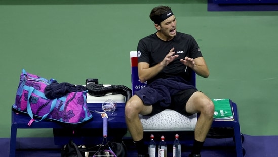 Taylor Fritz talks to his corner while playing Novak Djokovic during their Men's Quarterfinal match on Day Ten of the 2025 US Open (Getty Images via AFP)
