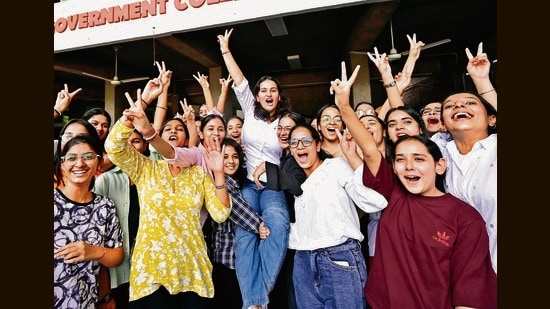 Independent candidate Shreeyal Chauhan lifted by her peers after she was elected the council president of PGGCG-11 in Chandigarh on Wednesday. (Ravi Kumar/HT)