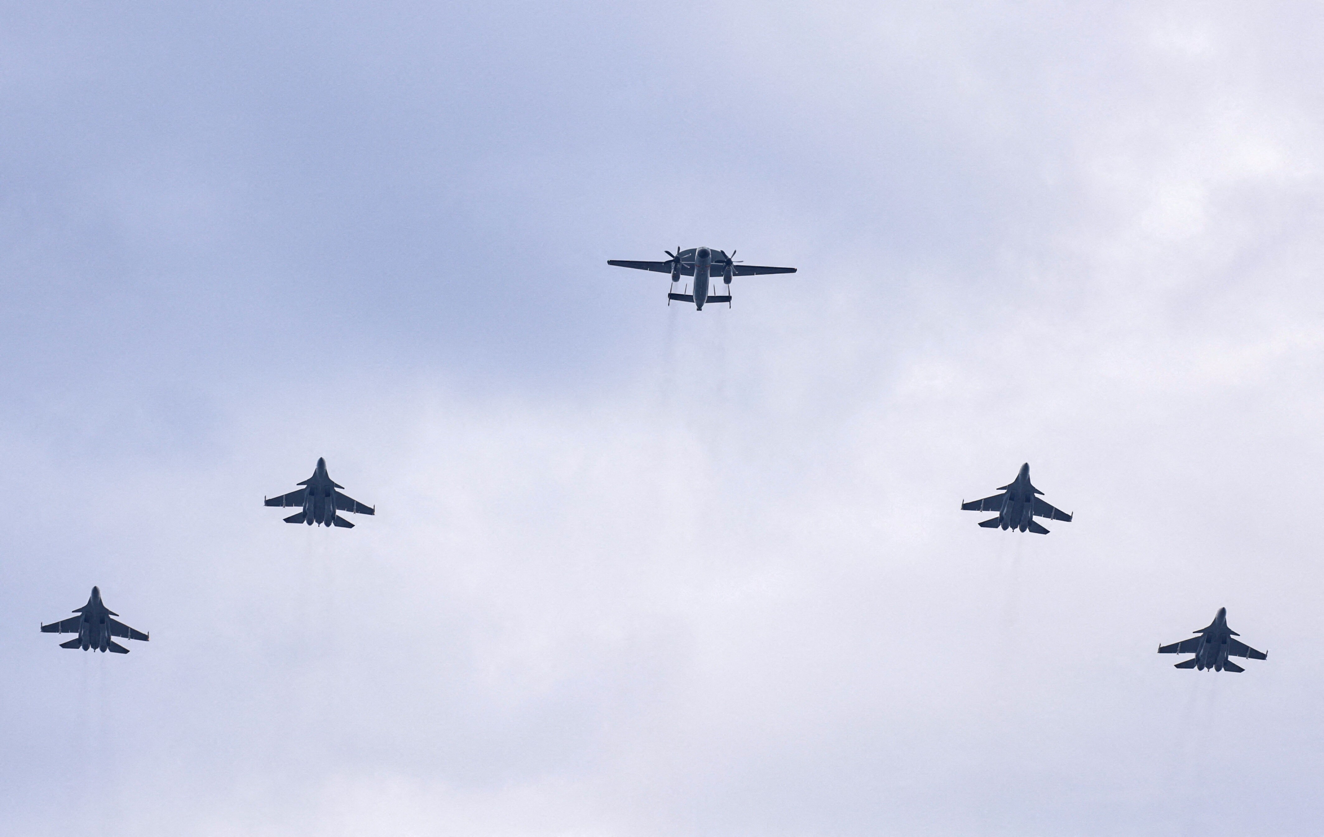 Shenyang J-15 jet fighters and Xian KJ-600, an airborne early warning and control (AEW&C) aircraft, fly in formation during a flyover rehearsal ahead of a military parade to mark the 80th anniversary of the end of World War Two, in Beijing, China, (REUTERS)