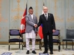 Russia's President Vladimir Putin (R) attends a meeting with Nepal's Prime Minister KP Sharma Oli during the Shanghai Cooperation Organisation (SCO) Summit in Tianjin.