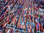 This picture shows an aerial view of shipping containers stacked at a port in Qingdao, in eastern China's Shandong province on September 4, 2025. (Photo by AFP) / China OUT)