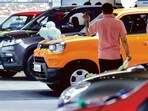 File photo of Maruti Suzuki cars inside a showroom.