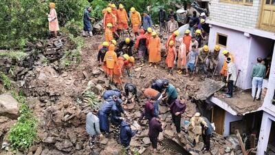A National Disaster Response Force (NDRF) team rescuing people trapped in the debris after a landslide struck the Inner Akhara Bazaar of Kullu on Thursday morning. (Aqil Khan/HT) A National Disaster Response Force (NDRF) team rescuing people trapped in the debris after a landslide struck the Inner Akhara Bazaar of Kullu on Thursday morning. (Aqil Khan/HT)
