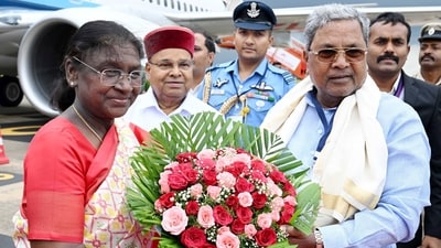 President Droupadi Murmu being welcomed by Karnataka Chief Minister Siddaramaiah on her arrival in Mysuru on Monday. (@rashtrapatibhvn X) President Droupadi Murmu being welcomed by Karnataka Chief Minister Siddaramaiah on her arrival in Mysuru on Monday. (@rashtrapatibhvn X)