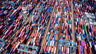 This picture shows an aerial view of shipping containers stacked at a port in Qingdao, in eastern China's Shandong province on September 4, 2025. (Photo by AFP) / China OUT) This picture shows an aerial view of shipping containers stacked at a port in Qingdao, in eastern China's Shandong province on September 4, 2025. (Photo by AFP) / China OUT)