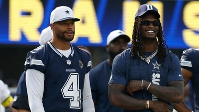 Dak Prescott #4 and CeeDee Lamb #88 of the Dallas Cowboys laugh on the sidelines during the Rams preseason game (Getty Images via AFP) Dak Prescott #4 and CeeDee Lamb #88 of the Dallas Cowboys laugh on the sidelines during the Rams preseason game (Getty Images via AFP)
