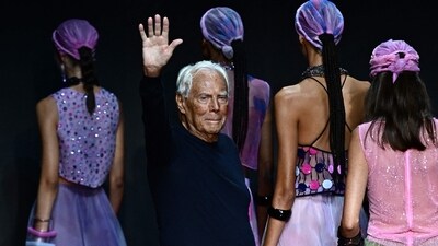 Italian designer Giorgio Armani waves from the runway of the Emporio Armani fashion show during the Milan Fashion Week Womenswear Spring/Summer 2024 on September 21, 2023 in Milan. Italian fashion great Giorgio Armani has died at the age of 91 "surrounded by his loved ones", his company said on September 4, 2025. (AFP) Italian designer Giorgio Armani waves from the runway of the Emporio Armani fashion show during the Milan Fashion Week Womenswear Spring/Summer 2024 on September 21, 2023 in Milan. Italian fashion great Giorgio Armani has died at the age of 91 "surrounded by his loved ones", his company said on September 4, 2025. (AFP)