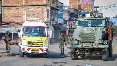 An ambulance rides past a security vehicle positioned in the middle of a road, during a curfew in Imphal on June 9, 2025, after violence errupted. (AFP file) An ambulance rides past a security vehicle positioned in the middle of a road, during a curfew in Imphal on June 9, 2025, after violence errupted. (AFP file)
