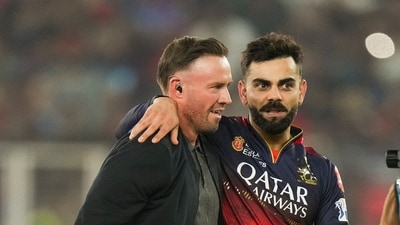 Royal Challengers Bengaluru's Virat Kohli being congratulated by former cricketer AB de Villiers after winning the IPL title (PTI)