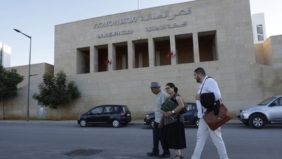 Friends and supporters of Ibtissame Lachgar, who faces trial over "offending Islam", walk outside the court in Rabat on September 3, 2025. (AFP) Friends and supporters of Ibtissame Lachgar, who faces trial over "offending Islam", walk outside the court in Rabat on September 3, 2025. (AFP)