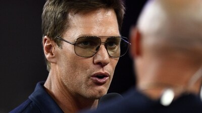 Retired Hall of Fame New England Patriot player Tom Brady talks with Brian Hoyer (IMAGN IMAGES via Reuters Connect)