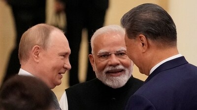 Indian Prime Minister Narendra Modi talks with Russian President Vladimir Putin and Chinese President Xi Jinping ahead of the Shanghai Cooperation Organization (SCO) Summit 2025 at the Meijiang Convention and Exhibition Centre in Tianjin, China.  SUO TAKEKUMA/Pool via REUTERS/File Photo (via REUTERS)