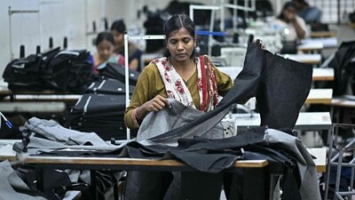 A woman working at a textile unit in India (HT_PRINT) A woman working at a textile unit in India (HT_PRINT)