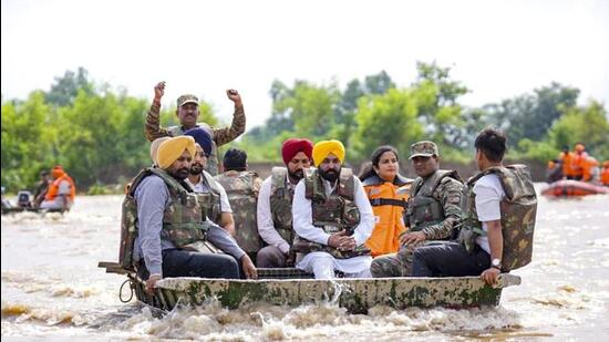 Punjab chief minister Bhagwant Mann touring a flood-hit area in Ferozepur district on Tuesday. (HT Photo)