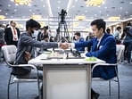 D Gukesh and Nodirbek Abdusattorov during a game. D Gukesh and Nodirbek Abdusattorov during a game.