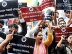 Members of Akhil Bharatiya Vidyarthi Parishad (ABVP) raise slogans against Shri Ramswaroop University administration during a protest over the police lathicharge on students in Barabanki, at the Gandhi statue, in Lucknow. (ANI File Photo)