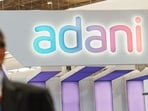 Bengaluru: An official walks past the stall of Adani Defence and Aerospace during the inauguration of Aero India 2023, at Yelahanka air base in Bengaluru, Monday,