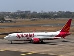 FILE PHOTO: A SpiceJet passenger aircraft taxis on the tarmac at Chhatrapati Shivaji International Airport in Mumbai.