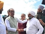 Union agriculture minister Shivraj Singh Chouhan meeting farmers in flood-hit Ajnala in Amritsar district on Thursday. (HT Photo) Union agriculture minister Shivraj Singh Chouhan meeting farmers in flood-hit Ajnala in Amritsar district on Thursday. (HT Photo)