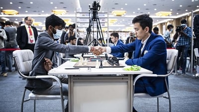 D Gukesh and Nodirbek Abdusattorov during a game. (FIDE) D Gukesh and Nodirbek Abdusattorov during a game. (FIDE)