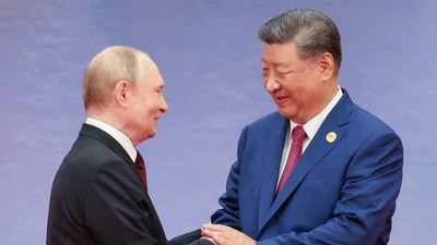 Vladimir Putin told his "dear friend" Xi Jinping that Russia's ties with Beijing are at "an unprecedentedly high level". (Reuters)