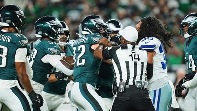 Philadelphia Eagles safety Reed Blankenship (32) and Dallas Cowboys' Marist Liufau, right, are separated by referee Shawn Smith (14) as they and others scuffle after a play in the first half of an NFL football game Thursday, Sept. 4, 2025, in Philadelphia. (AP) Philadelphia Eagles safety Reed Blankenship (32) and Dallas Cowboys' Marist Liufau, right, are separated by referee Shawn Smith (14) as they and others scuffle after a play in the first half of an NFL football game Thursday, Sept. 4, 2025, in Philadelphia. (AP)