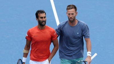 Yuki Bhambri of India (L) talks with partner Michael Venus of New Zealand against Joe Salisbury of the United Kingdom and Neal Skupski of the United Kingdom during their Men's Doubles Semifinal (Getty Images via AFP)