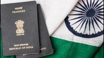Indian passport and authentic indian tricolour flag made up of khadi or pure cotton material - Stock image (Getty Images/iStockphoto)