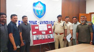 The Hyderabad police with the mobile phones seized from the drug peddlers, who were arrested on Friday. (HT PHOTO) The Hyderabad police with the mobile phones seized from the drug peddlers, who were arrested on Friday. (HT PHOTO)