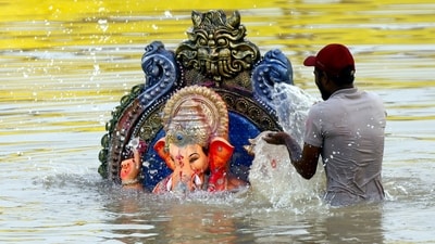 An idol of Lord Ganesh being immersed in the Sabarmati river as part of Ganesh Chaturthi festival celebrations, in Ahmedabad. (PTI) An idol of Lord Ganesh being immersed in the Sabarmati river as part of Ganesh Chaturthi festival celebrations, in Ahmedabad. (PTI)