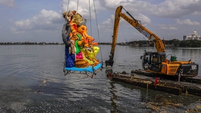 An idol of Lord Ganesh is being immersed at Hussain Sagar lake as part of Ganesh Chaturthi celebrations, in Hyderabad. (PTI) An idol of Lord Ganesh is being immersed at Hussain Sagar lake as part of Ganesh Chaturthi celebrations, in Hyderabad. (PTI)