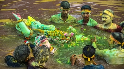 An idol of Lord Ganesh being immersed as part of the Ganesh Chaturthi festival celebrations, in Kanpur. (PTI) An idol of Lord Ganesh being immersed as part of the Ganesh Chaturthi festival celebrations, in Kanpur. (PTI)