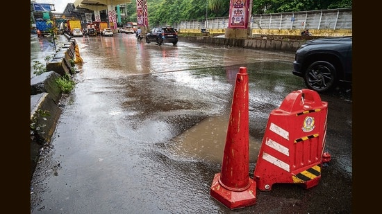 A motorcyclist was trying to avoid a pothole when the bike slipped, causing the pillion rider to be crushed under a bus’s wheel. (Satish Bate/ Hindustan Times)