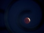 A rare 'blood Moon' total lunar eclipse is captured near totality from the village of Donon, 40 km from Pontevedra, in northwestern Spain, early on March 14, 2025. A rare 'blood Moon' total lunar eclipse is captured near totality from the village of Donon, 40 km from Pontevedra, in northwestern Spain, early on March 14, 2025.