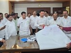 On Thursday, Ganesh Naik’s son, former MP Sanjeev Naik, and his nephew, former mayor Sagar Naik, led a BJP delegation to the NMMC headquarters and submitted a detailed technical rebuttal (HT Photo) On Thursday, Ganesh Naik’s son, former MP Sanjeev Naik, and his nephew, former mayor Sagar Naik, led a BJP delegation to the NMMC headquarters and submitted a detailed technical rebuttal (HT Photo)