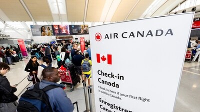 Passengers queue for check-in for their flights at Toronto Pearson International Airport, following the end of the Air Canada labour strike, in Mississauga, Ontario, Canada, August 19, 2025. (Reuters)