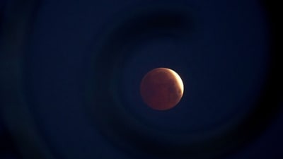 A rare 'blood Moon' total lunar eclipse is captured near totality from the village of Donon, 40 km from Pontevedra, in northwestern Spain, early on March 14, 2025. (AFP File) A rare 'blood Moon' total lunar eclipse is captured near totality from the village of Donon, 40 km from Pontevedra, in northwestern Spain, early on March 14, 2025. (AFP File)