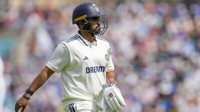 Karun Nair returns to the pavilion after his dismissal on day two of the fifth Test against England. (PTI)