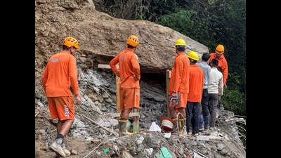 NDRF personnel conduct a search and rescue operation at a landslide-hit area, in Akhara Bazaar, Kullu district on Saturday. (PTI) NDRF personnel conduct a search and rescue operation at a landslide-hit area, in Akhara Bazaar, Kullu district on Saturday. (PTI)