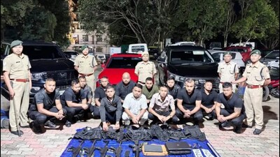 The convoy, with tinted glasses and a siren on one vehicle, carried 12 men in black fatigues.