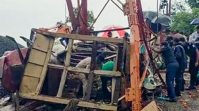 Officials and others stand near the site where the cable wire of a cargo ropeway snapped, killing at least six people, at the Pavagadh Hill temple, in Panchmahal district, Gujarat, Saturday, Sept. 6, 2025. (PTI)