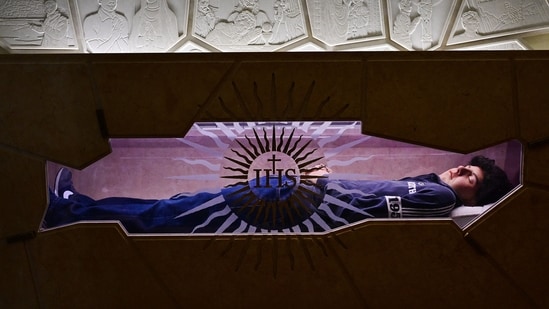 A picture shows the tomb of Blessed Carlo Acutis, an adolescent who spent his life spreading his faith online, earning the moniker "God's Influencer", in the Shrine of the Renunciation in Assisi, part of the Church of Saint Mary Major, on April 3, 2025. (AFP)