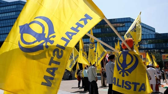 Members of the Sikh community hold flags as they protest Prime Minister of India Shri Narendra Modi in front of Calgary City Hall on June 16, 2025 in Calgary, Alberta. (Representative image/AFP)