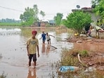 Children walk through a flooded area at Machhiwala village near Ramdas in Amritsar on Sunday.. (Photo by Sameer Sehgal/Hindustan Times) (Sameer Sehgal/Hindustan Times) Children walk through a flooded area at Machhiwala village near Ramdas in Amritsar on Sunday.. (Photo by Sameer Sehgal/Hindustan Times) (Sameer Sehgal/Hindustan Times)
