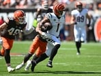 Cincinnati Bengals wide receiver Ja'Marr Chase (1) runs against Cleveland Browns linebacker Mohamoud Diabate (43) and linebacker Carson Schwesinger (49) during the first half at Huntington Bank Field.