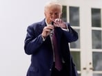 President Donald Trump speaks at a dinner in the Rose Garden of the White House.